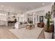Bright, open-concept living area featuring modern furnishings, neutral tones, and seamless flow to the kitchen at 2636 E Virginia St, Mesa, AZ 85213