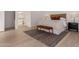 Neutral main bedroom with a bench seat at the foot of the bed at 2636 E Virginia St, Mesa, AZ 85213
