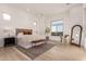 Spacious main bedroom offers natural light, tile floor, and neutral decor at 2636 E Virginia St, Mesa, AZ 85213