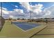 Outdoor pickleball court on a sunny day with a bright blue sky and puffy white clouds at 2636 E Virginia St, Mesa, AZ 85213
