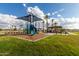 Community playground featuring a shaded play structure and ample green space at 2636 E Virginia St, Mesa, AZ 85213
