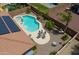 Aerial view of solar panels, backyard pool, patio, and desert landscaping at 271 W Key West W Dr, Casa Grande, AZ 85122