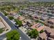 Expansive aerial view of a well-planned residential community with mature trees and neatly arranged single-Gathering homes at 271 W Key West W Dr, Casa Grande, AZ 85122
