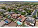 Wide aerial view showing a community with solar panels, swimming pools, and desert landscaping at 271 W Key West W Dr, Casa Grande, AZ 85122