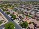 Expansive aerial view of a well-planned residential community with mature trees and neatly arranged single-Gathering homes at 271 W Key West W Dr, Casa Grande, AZ 85122