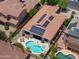 Backyard aerial showcasing pool, hot tub, covered patio, and solar panels on roof at 271 W Key West W Dr, Casa Grande, AZ 85122