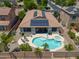 Backyard aerial showcasing pool, hot tub, covered patio, and solar panels on roof at 271 W Key West W Dr, Casa Grande, AZ 85122