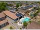 Backyard aerial showcasing pool, hot tub, outdoor dining, and solar panels on roof at 271 W Key West W Dr, Casa Grande, AZ 85122