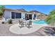 Backyard with pool, patio set, and solar panels on the roof of the house at 271 W Key West W Dr, Casa Grande, AZ 85122