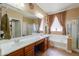 Bright bathroom showcasing dual sinks, a large mirror, and separate shower at 271 W Key West W Dr, Casa Grande, AZ 85122