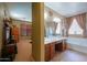 A Primary bathroom featuring dual sinks, a bathtub, and a separate shower at 271 W Key West W Dr, Casa Grande, AZ 85122