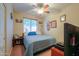 Comfortable bedroom with a ceiling fan, and natural light streaming in through the window at 271 W Key West W Dr, Casa Grande, AZ 85122