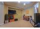 Entertaining bonus room with media center, mounted antlers, and decorative shelving at 271 W Key West W Dr, Casa Grande, AZ 85122