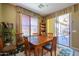 Cozy dining area featuring a wooden table and chairs, with outdoor access to a relaxing patio space at 271 W Key West W Dr, Casa Grande, AZ 85122