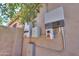 Exterior wall featuring solar panel system components with electrical boxes and conduit at 271 W Key West W Dr, Casa Grande, AZ 85122