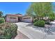 Attractive single-story home with a three-car garage, spacious driveway, and landscaped front yard at 271 W Key West W Dr, Casa Grande, AZ 85122