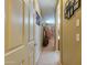 A hallway with neutral tones and carpet flooring, provides access to various rooms at 271 W Key West W Dr, Casa Grande, AZ 85122