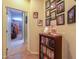 Inviting hallway with bookshelves and framed portraits, adding character at 271 W Key West W Dr, Casa Grande, AZ 85122