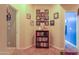 Charming hallway adorned with framed photos and a bookshelf filled with various titles at 271 W Key West W Dr, Casa Grande, AZ 85122