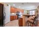 Kitchen features granite countertops, wood cabinetry, and stainless steel appliances at 271 W Key West W Dr, Casa Grande, AZ 85122