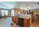 Kitchen featuring granite countertops, stainless sink, and access to dining area at 271 W Key West W Dr, Casa Grande, AZ 85122