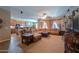 Spacious living room open to kitchen featuring a sectional sofa and natural light at 271 W Key West W Dr, Casa Grande, AZ 85122
