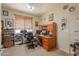 Functional office space with built-in shelving, a comfortable desk, and ample storage at 271 W Key West W Dr, Casa Grande, AZ 85122