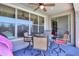 Cozy outdoor seating area with a ceiling fan and views of the backyard and pool at 271 W Key West W Dr, Casa Grande, AZ 85122