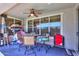 Enclosed patio area with ceiling fan, wicker furniture, and a window view of the backyard at 271 W Key West W Dr, Casa Grande, AZ 85122