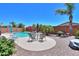 Beautiful backyard pool with palm trees, patio, and lounge furniture, perfect for relaxation at 271 W Key West W Dr, Casa Grande, AZ 85122