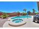 Inviting backyard features a sparkling pool, spa, and desert landscaping perfect for relaxation at 271 W Key West W Dr, Casa Grande, AZ 85122