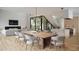 Open-concept dining room with modern light fixtures, stylish furniture, and an open flow to the kitchen at 3828 E Monterosa St, Phoenix, AZ 85018