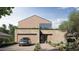Modern home with a stone facade, wooden upper level, and neat landscaping at 3828 E Monterosa St, Phoenix, AZ 85018