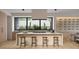 Bright, modern kitchen with a large island, sleek countertops, and wine rack display at 3828 E Monterosa St, Phoenix, AZ 85018