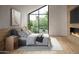 Comfortable bedroom with a large window, modern fireplace, and natural light at 3828 E Monterosa St, Phoenix, AZ 85018