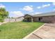 The expansive backyard showcases lush greenery and a covered patio, ideal for outdoor gatherings at 40020 N Cape Wrath Dr Dr, San Tan Valley, AZ 85140