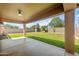 Covered patio overlooking the spacious backyard with lush lawn and privacy fence at 40020 N Cape Wrath Dr Dr, San Tan Valley, AZ 85140
