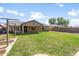 Backyard featuring lush lawn, covered patio, a privacy fence and exterior view of home at 40020 N Cape Wrath Dr Dr, San Tan Valley, AZ 85140