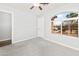 Neutral bedroom with plush carpeting, lots of natural light, and updated light fixtures at 40020 N Cape Wrath Dr Dr, San Tan Valley, AZ 85140