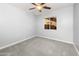 This bedroom features neutral paint and carpet, along with a ceiling fan and updated lighting at 40020 N Cape Wrath Dr Dr, San Tan Valley, AZ 85140