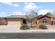 Charming single-story brick home featuring a two-car garage and low-maintenance desert landscaping at 40020 N Cape Wrath Dr Dr, San Tan Valley, AZ 85140