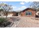 Beautiful single-Gathering house with desert landscaping, brick accents, and a well-maintained front yard at 40020 N Cape Wrath Dr Dr, San Tan Valley, AZ 85140