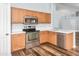 Well-lit kitchen features wood cabinets, stainless steel oven, and white countertops at 40020 N Cape Wrath Dr Dr, San Tan Valley, AZ 85140