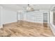 Large living area featuring hardwood floors, built-in shelving, and a ceiling fan at 40020 N Cape Wrath Dr Dr, San Tan Valley, AZ 85140