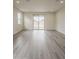Bright living room with recessed lights and glass sliding doors at 40030 W Bunker Dr, Maricopa, AZ 85138