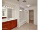 Bathroom showcasing the vanity with a bathtub-shower combination and walk-in closet at 4252 E Vest Ave, Gilbert, AZ 85295