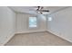Bright bedroom features neutral carpet, white walls, a ceiling fan, and window with blinds at 4252 E Vest Ave, Gilbert, AZ 85295