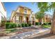Charming two-story home with stucco siding, stone accents, well-manicured landscaping, and covered front porch at 4252 E Vest Ave, Gilbert, AZ 85295