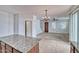 Open concept floor plan from kitchen island to living room with lots of natural light at 4252 E Vest Ave, Gilbert, AZ 85295