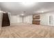 This large bonus room has carpeted floors, recessed lights, and a kitchenette, ideal for entertaining at 4255 S Marisol Ln, Gilbert, AZ 85297